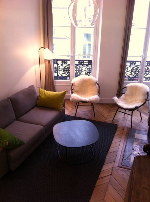 Bright, well designed salon with lovely chevron parquet.