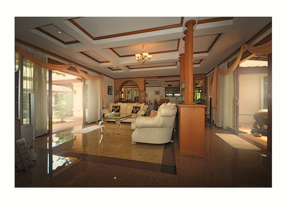 Cozy living room overlooking the pool and the golf course. Great way to relax and enjoy your coffee.