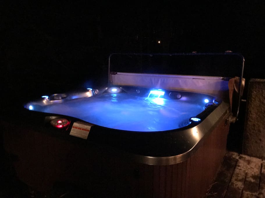Our large Hot Tub lit up at night