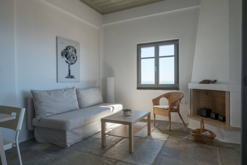 Spacious living space with snug sofa; turns into double bed for extra guests
