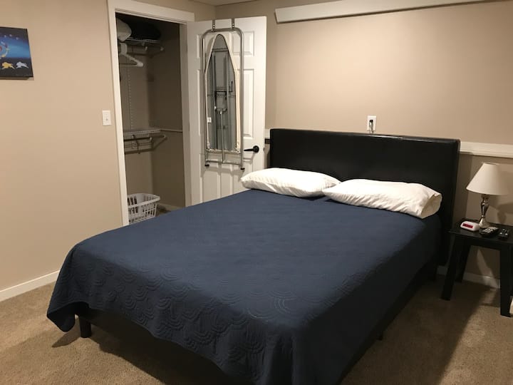Bedroom #2 with queen size bed, closet, tv and private entrance to outside