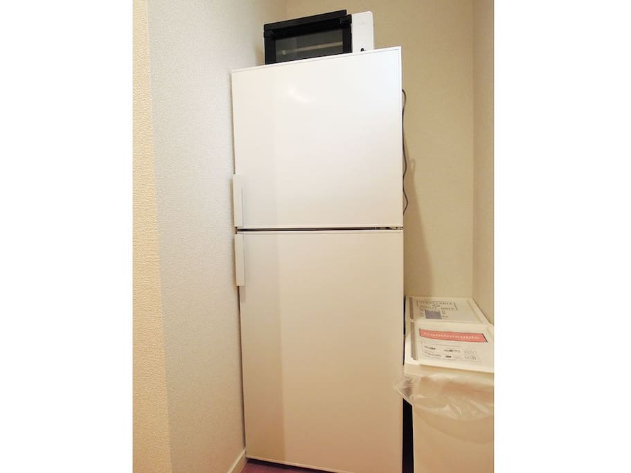 A refrigerator and microwave oven for use of you