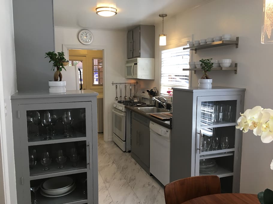 Beautiful galley kitchen with lots of bright sunshine. A great place to start your day with a fresh cup of coffee.