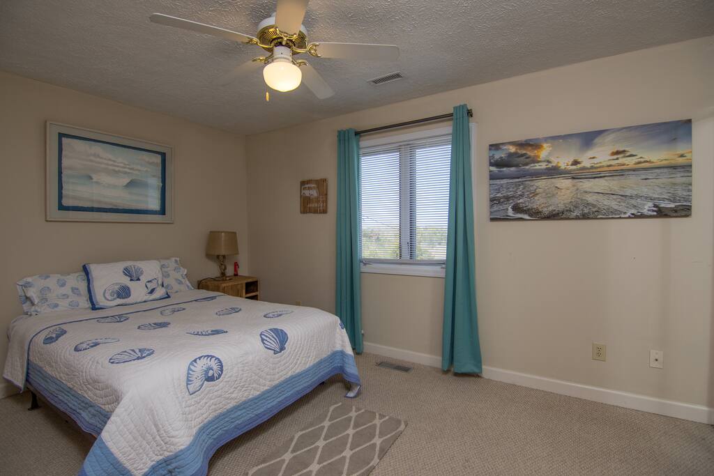 Private room with queen & full bath attached. Overlooks the marsh across the street.