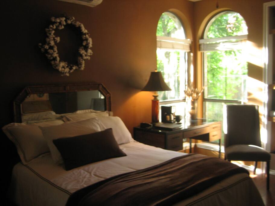 Views are of a secluded garden & birdfeeder. Private tea & coffee set ups are in the room. Amenities include a big screen TV, Wi-Fi & a private bathroom.