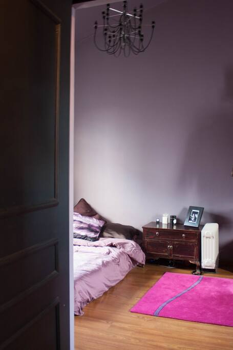 Spacious master bedroom with blackout curtains