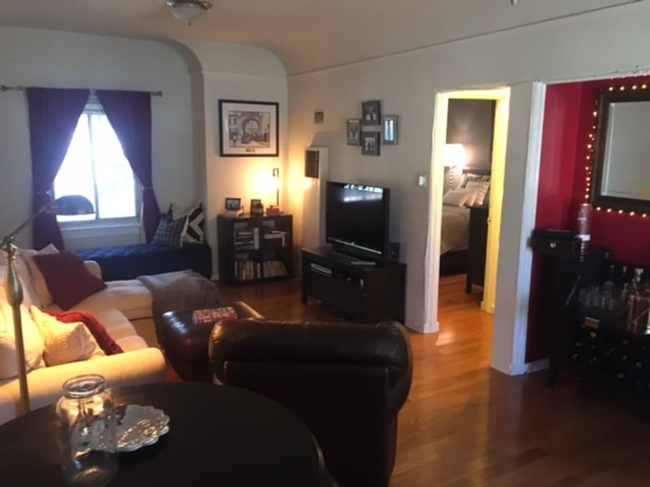 Living room, reading area, TV, DVD player,USB cable to stream from apple MacBook to TV.