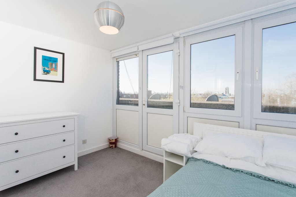 Bedroom 1, with a double bed complete with its own mini-balcony