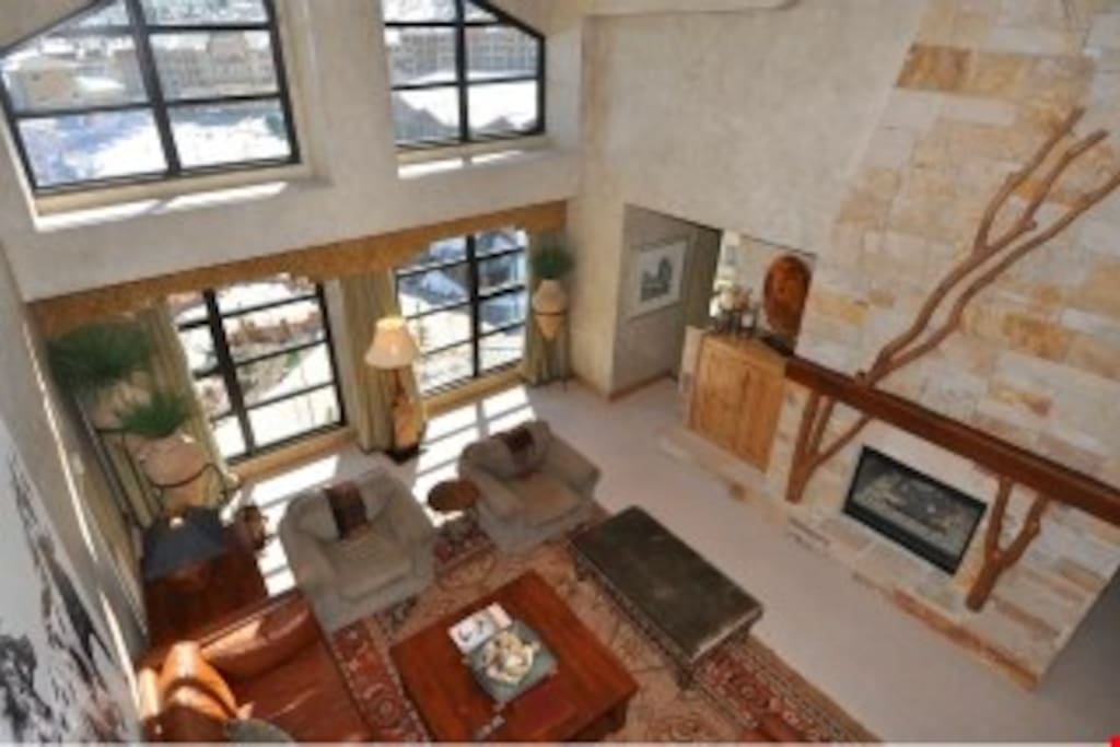 Enjoy vaulted ceilings and beautiful floor to ceiling windows with mountain views