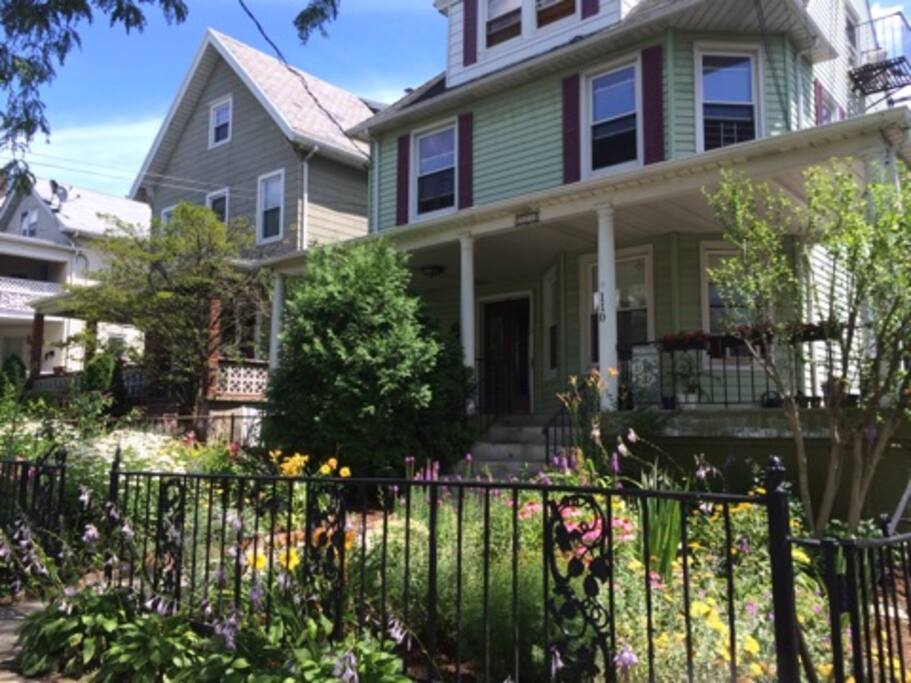 A 100-year old Victorian 3-family house with a beautiful front garden