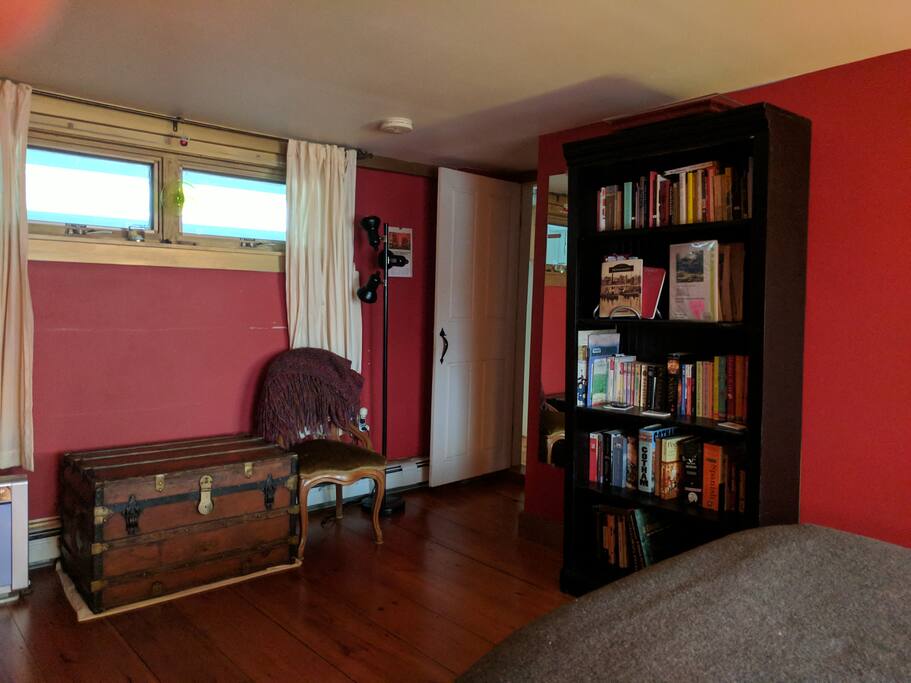 View of the entryway and windows overlooking interior hallway.