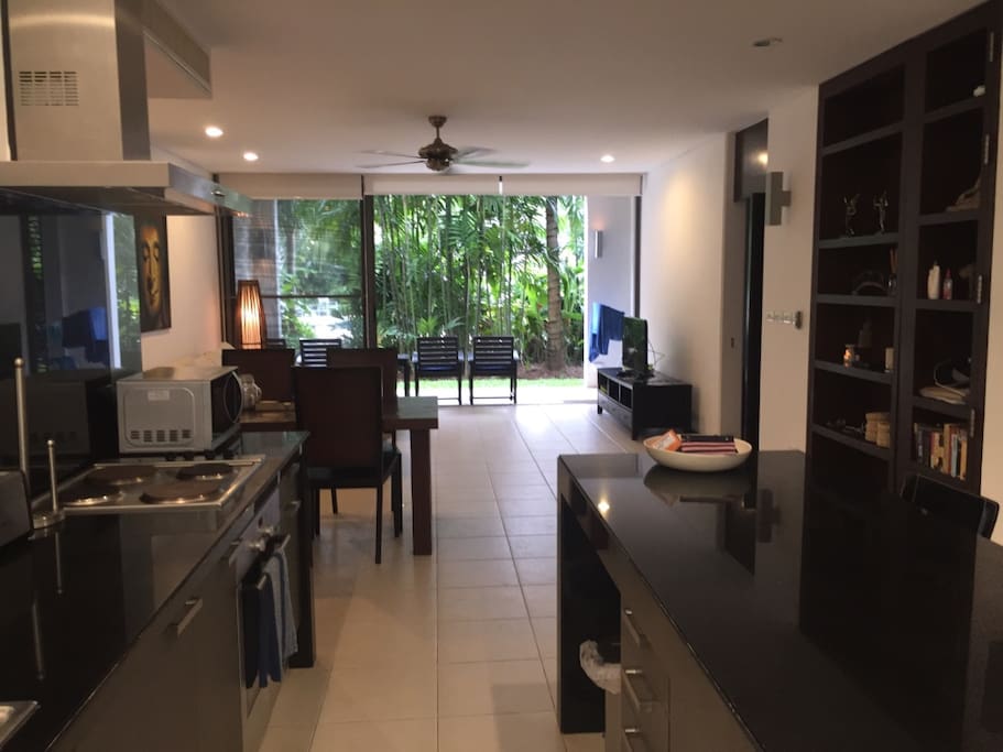 Large Kitchen area with cooking facilities and washing machine