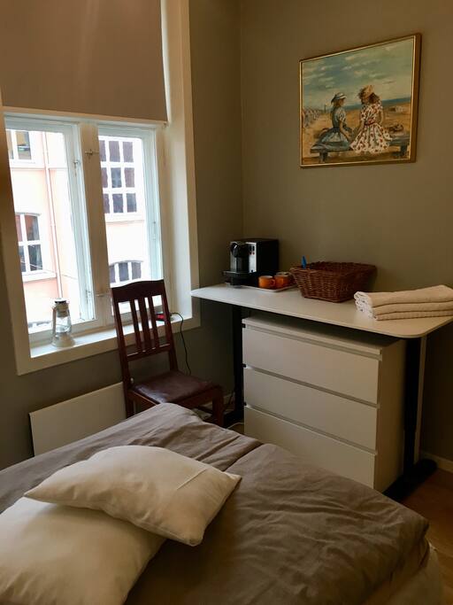 Your room. Desk, drawers and Coffee machine.