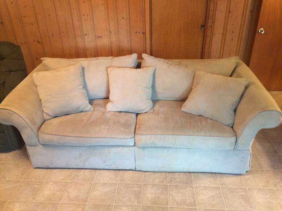 Some guests like this plush couch instead. You can take the pillows off it and there's a lot of room and can stretch out on it. It's nice!
