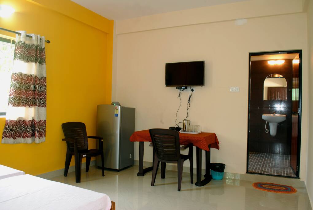 LED TV, fridge, table, attached bathroom
