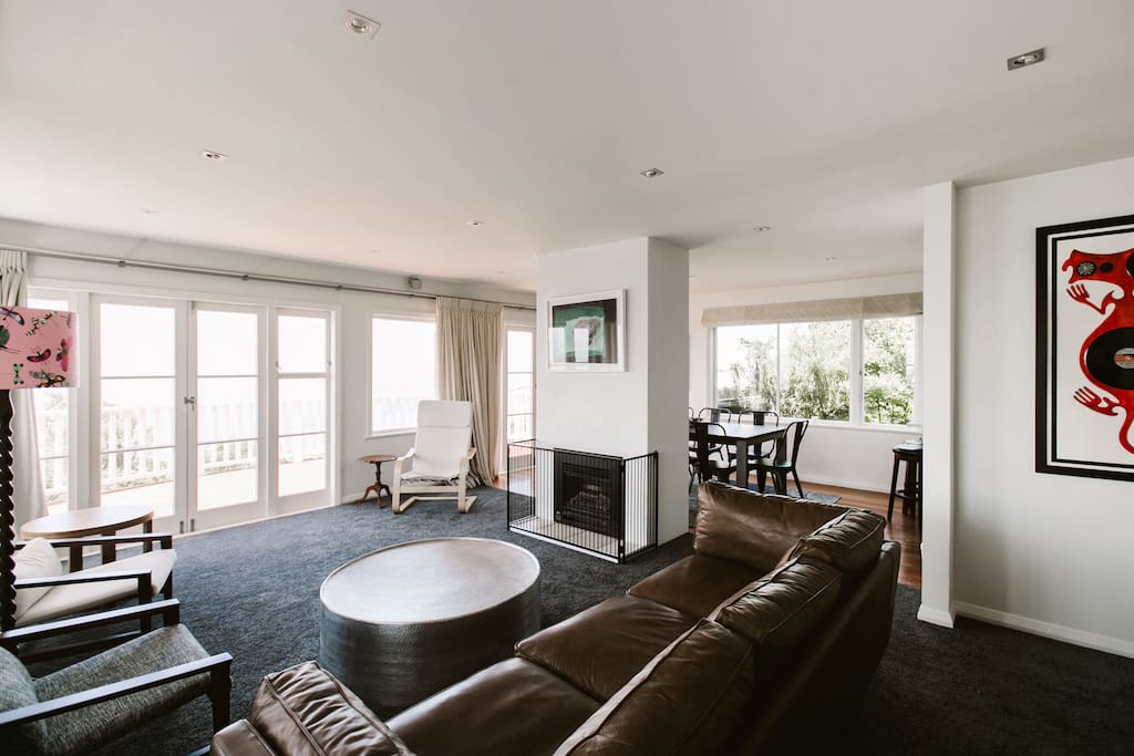 Light and airy open plan living and dining room with incredible views over Wellington harbour