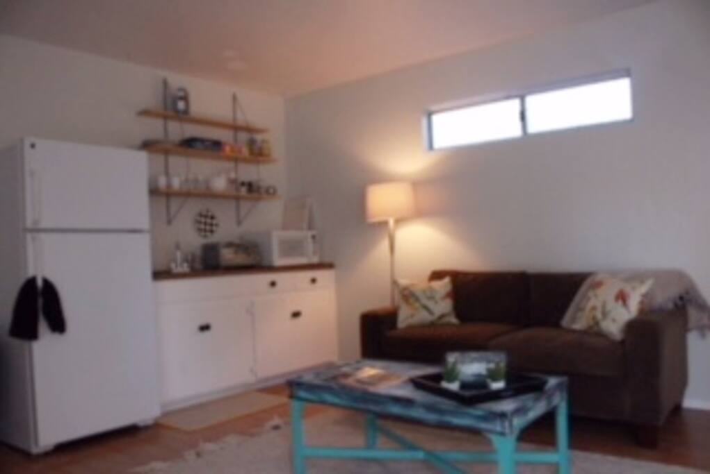 Kitchenette with micowave, toaster oven, Coffee Kurig, sink and full sized fridge.