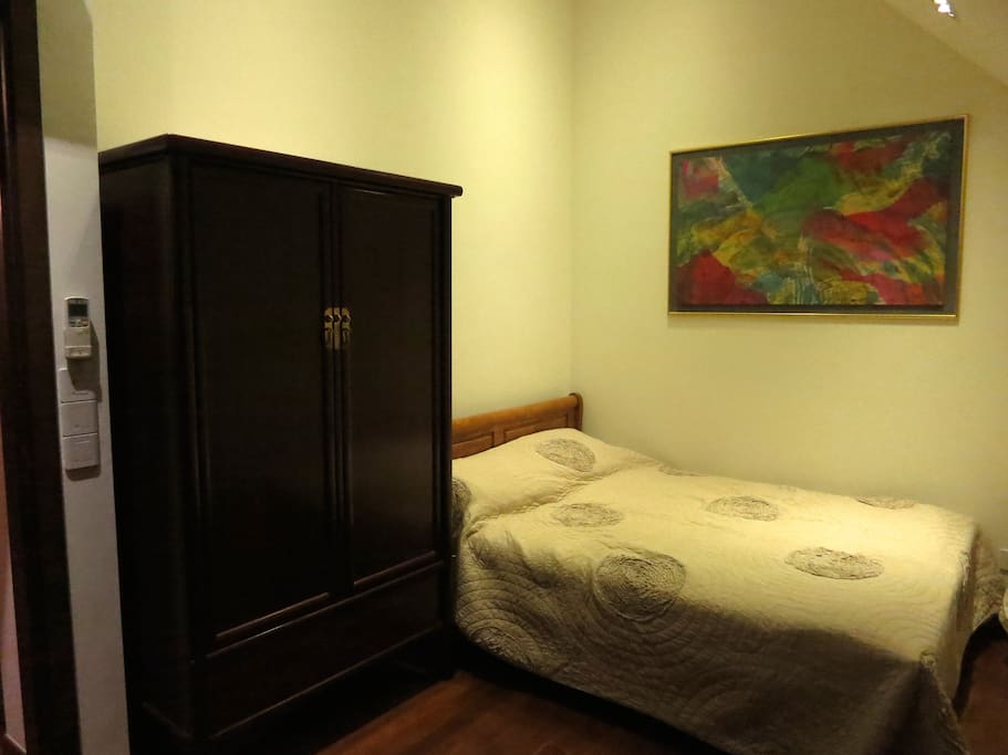 High ceiling, queen size bed with antique wardrobe