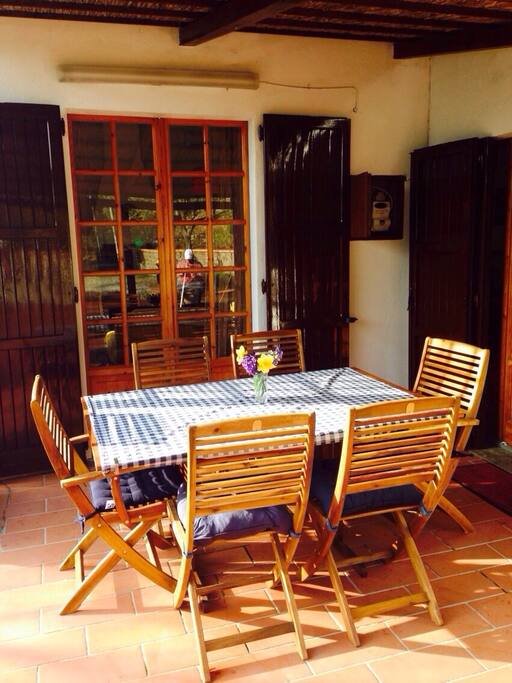 Outdoor dining patio with a view of Lake Trasimeno.