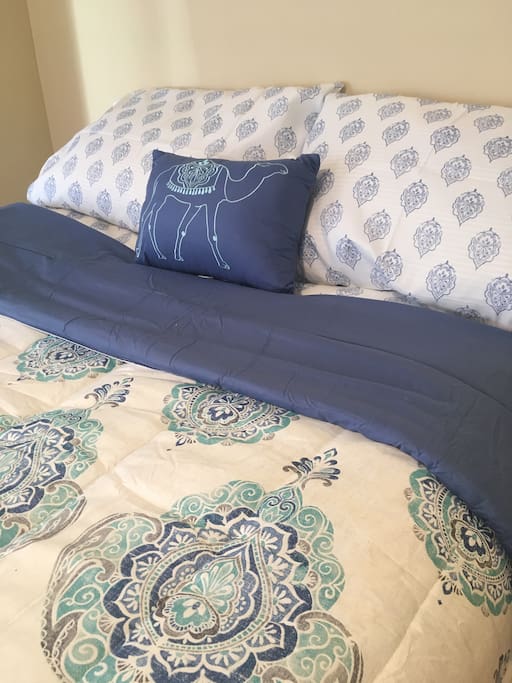 Lots of fluffy pillow, as well as sheets, blankets, and comforters are provided to keep you warm in winter. And there's AC in the room to keep you comfortable in the summer too.