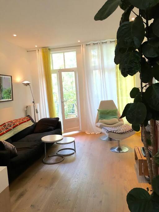 Livingroom area with doors to the porch and big garden