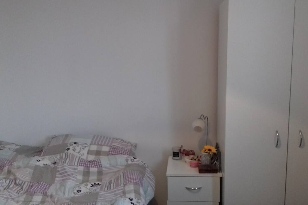 There is a double bed, 2 chests of drawers and a wardrobe (that will be mostly emptied)