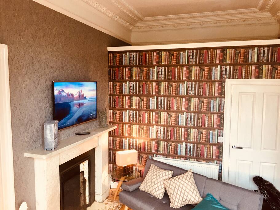 Lounge. The bookcase is actually the bathroom wall.