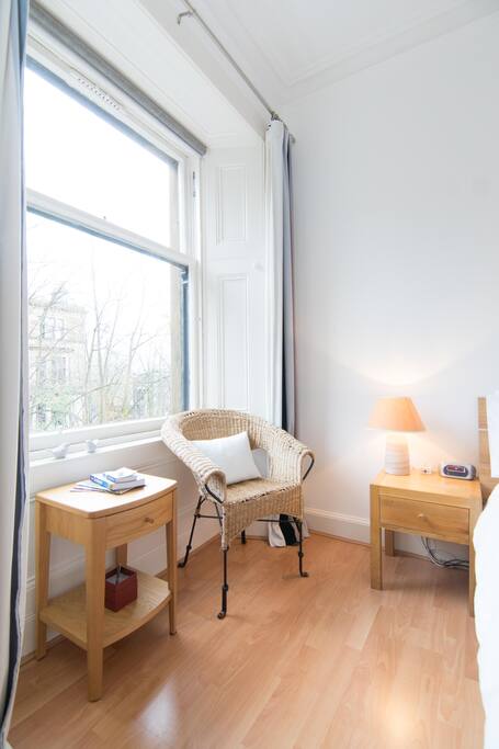 The room is in a quiet, tree-lined street in the heart of Glasgow's west end.