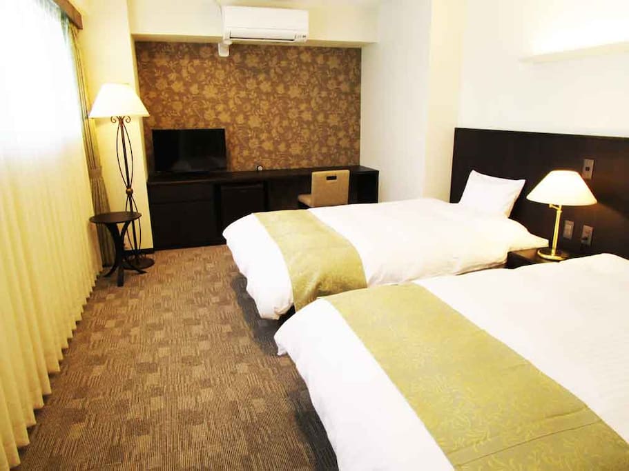 The bright room with large windows.