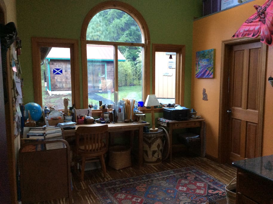 Desk and study area near back door with ½ bathroom off to the right.