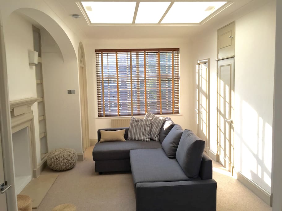 Reception & livingroom with a skylight and an old & charm fireplace