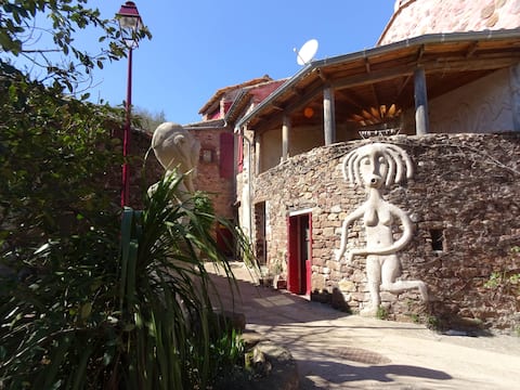 Atypical stone house, African huts