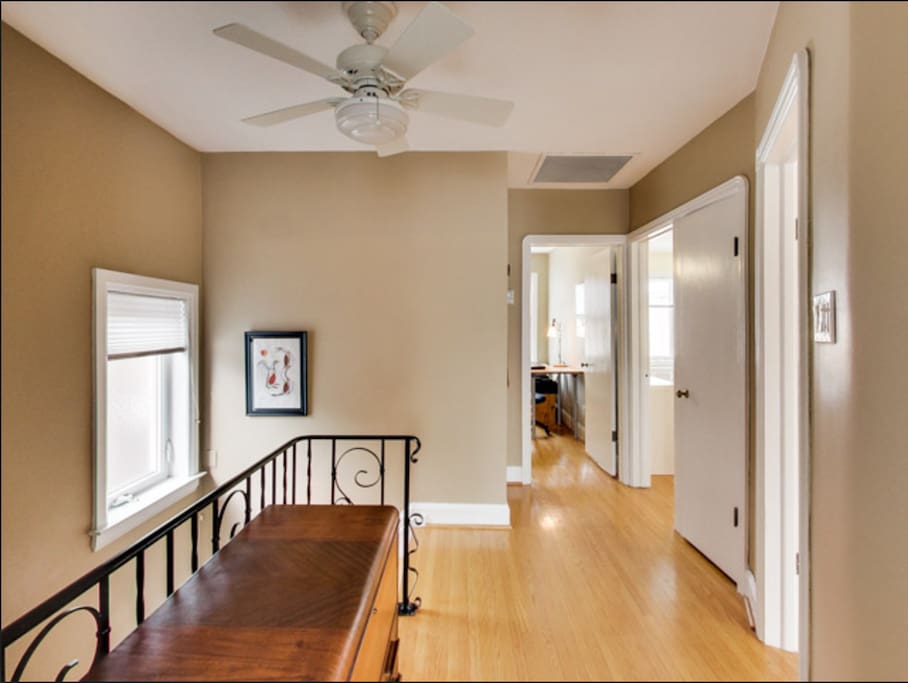 Hallway to bedrooms, lounge/kitchen and master bathroom.