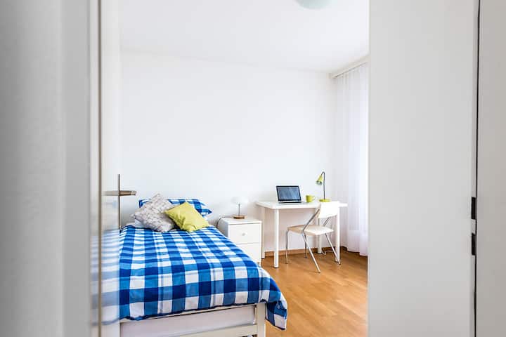 Spacious second bedroom with two single beds.  