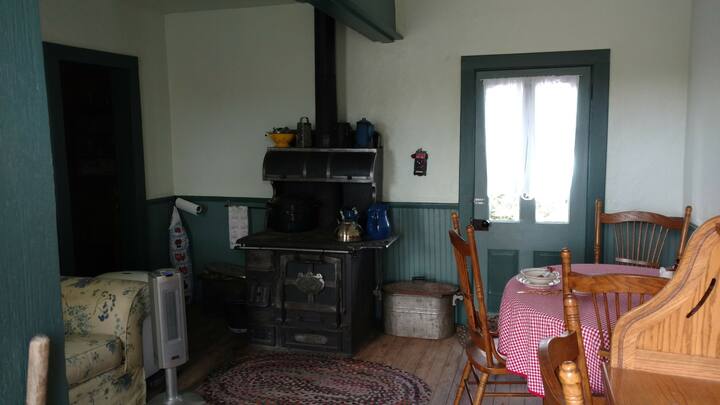 Oak table now set for you to use by the old black Home Comfort Cookstove from Cripple Creek/Victor area. Oak table provided by recent guests stays in the cottage, purchased at God's pantry so the money from the purchase used to feed hungry people. 