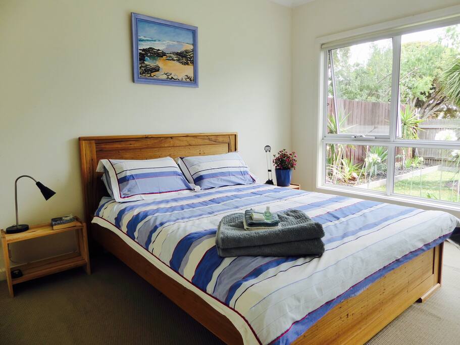 Main bedroom with Queen size bed & ceiling fan