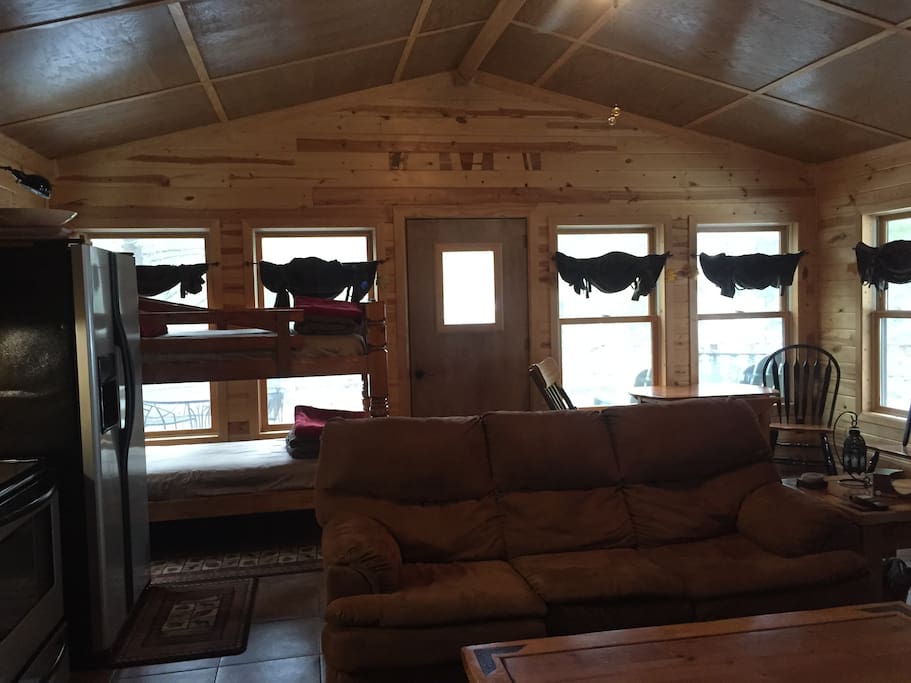 Cabin is built on stilts in the canopy of the pines. 200 acres to roam and additional public land.