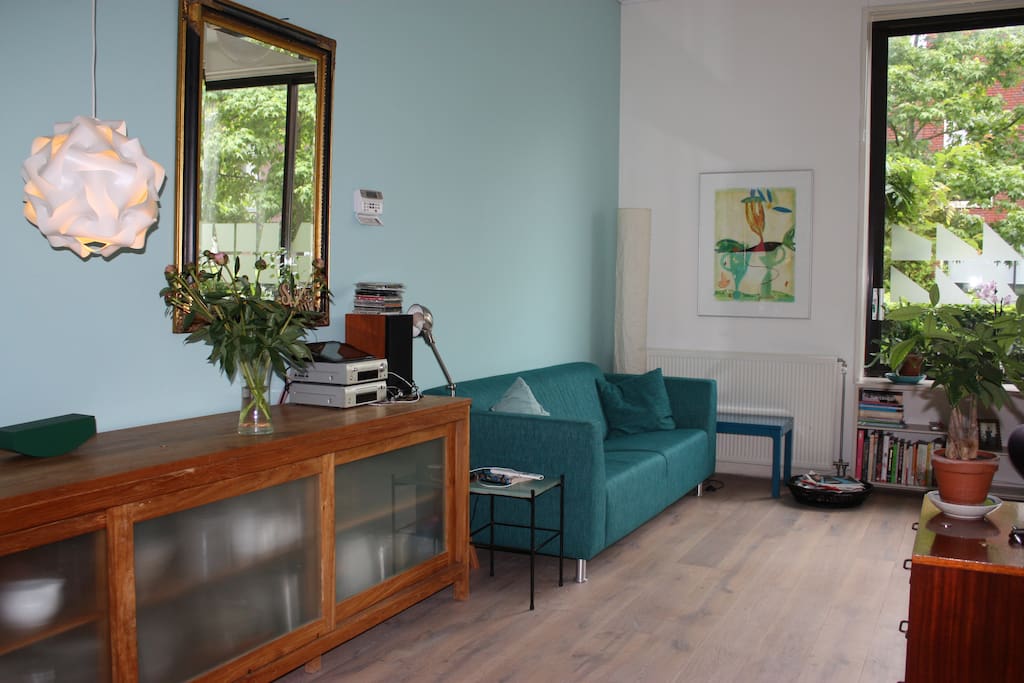 Living room facing the sunny community patio at the front of the house.