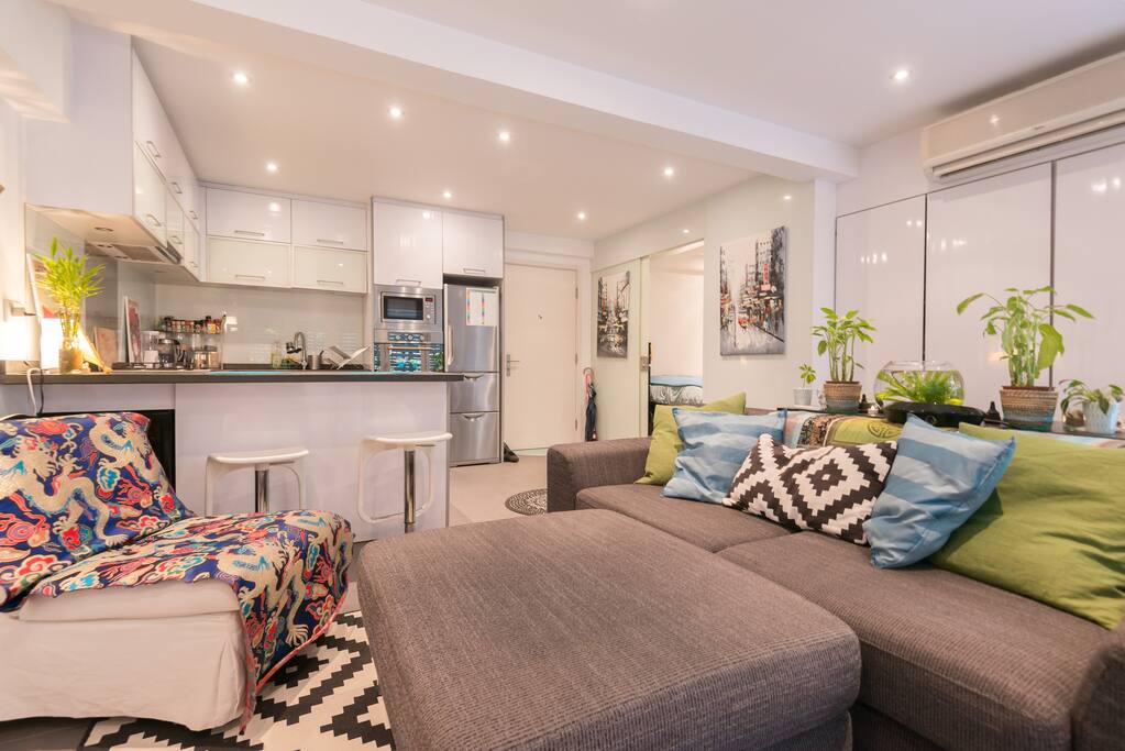 Sofa is big enough for an extra person, with bedding in the storage closet