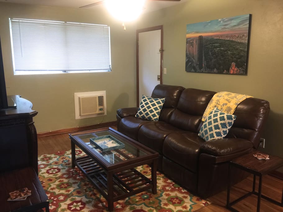Comfortable reclining leather sofa. Large screen TV, wifi, cable.
