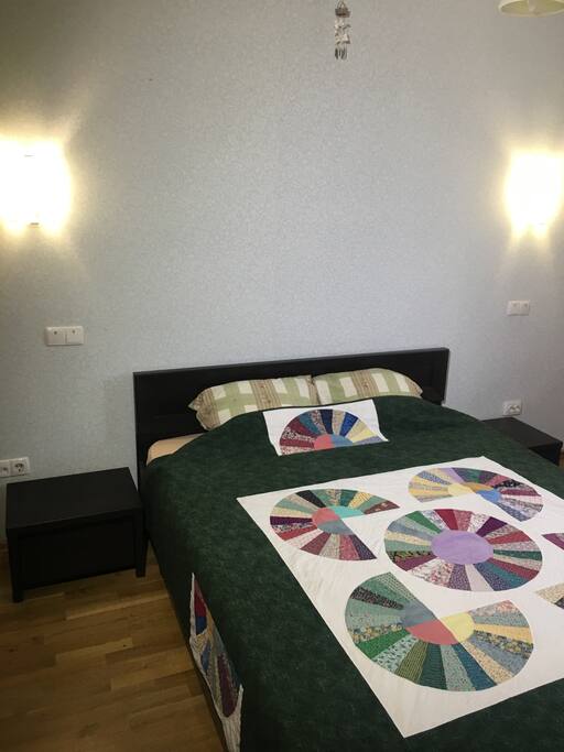 Bedroom with end tables and reading lights for each side