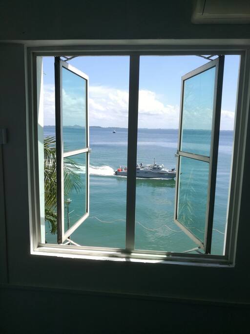 living room's window face the sea. beautiful sunset everyday