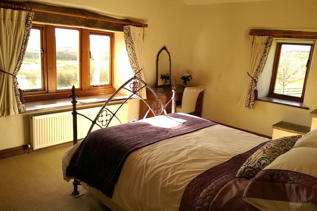 A beautiful bedroom with bags of character and long distance views