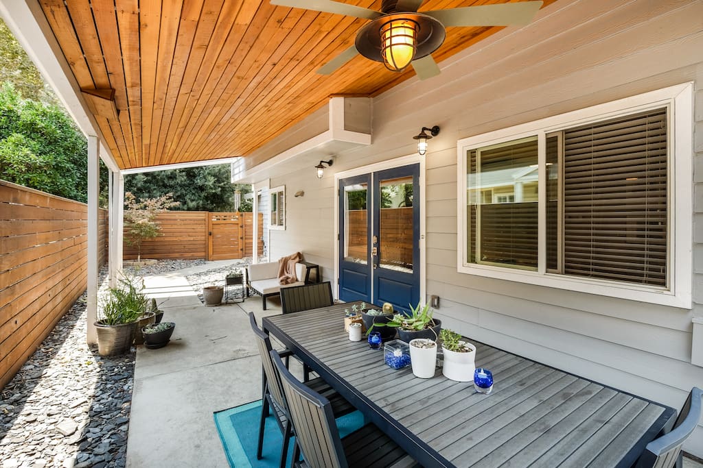 The front patio features outdoor seating for eight people.