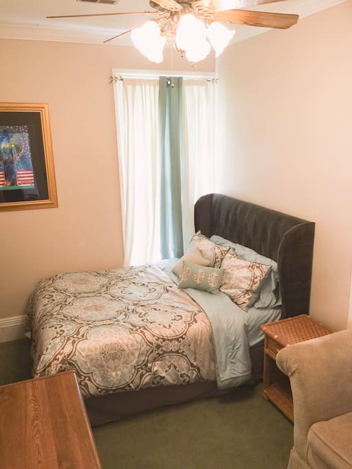 Queen size bed, dresser, closet, and desk. Room overlooks the garden.