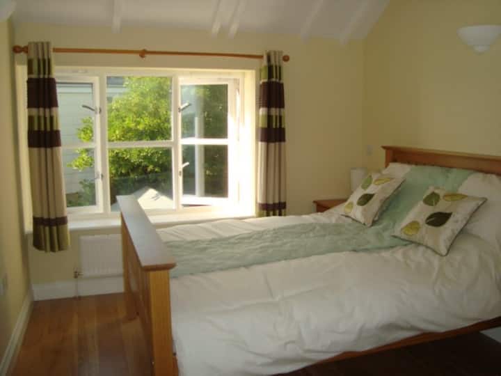 Double bedroom of Fisherman's Loft with side view of the harbour (sleeps 3)