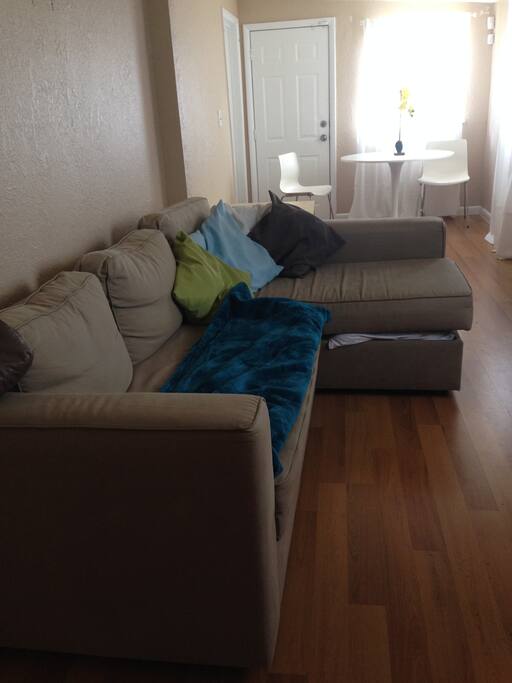Clean linen storage underneath couch.