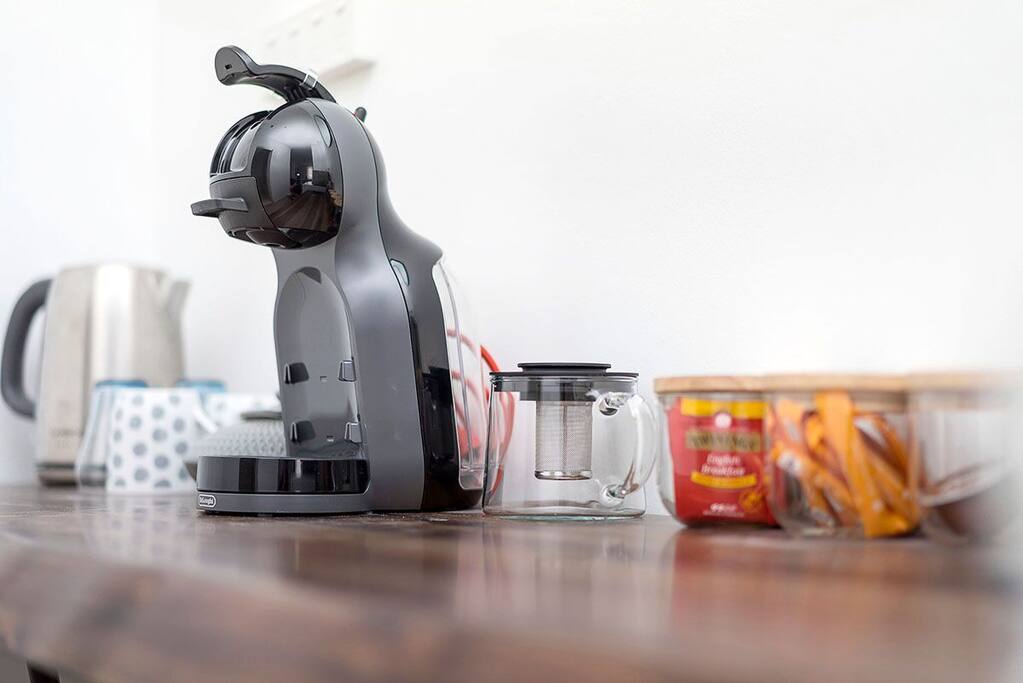 Coffee machine, toaster, kettle, microwave, and mineral water filter.
