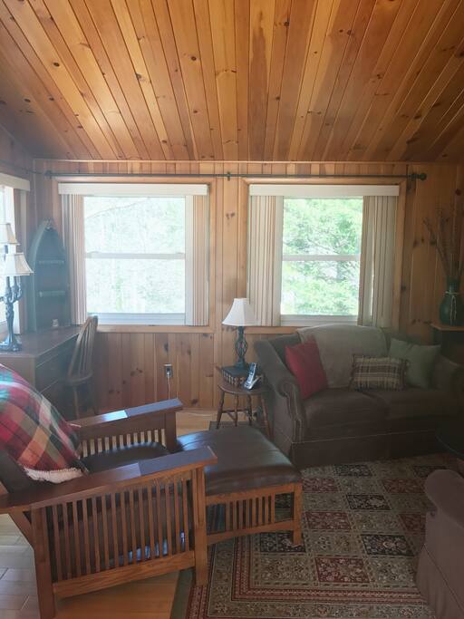 Cozy, clean and comfortable living area with views of outside all around.