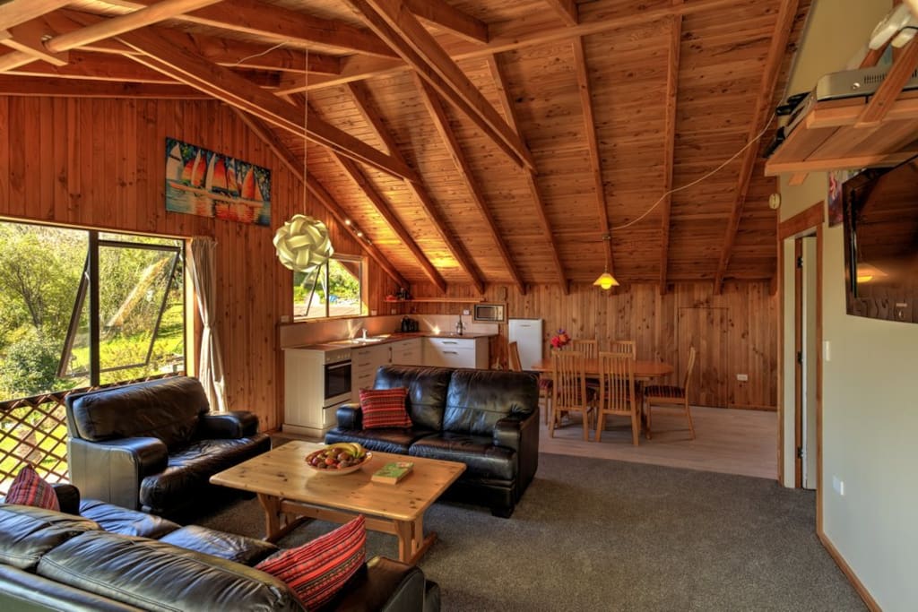 It shows the light in the kitchen, the beautiful ceiling, open plan living area with the comfortable leather couches. Cozy to relax after a long and beautiful day in the Park